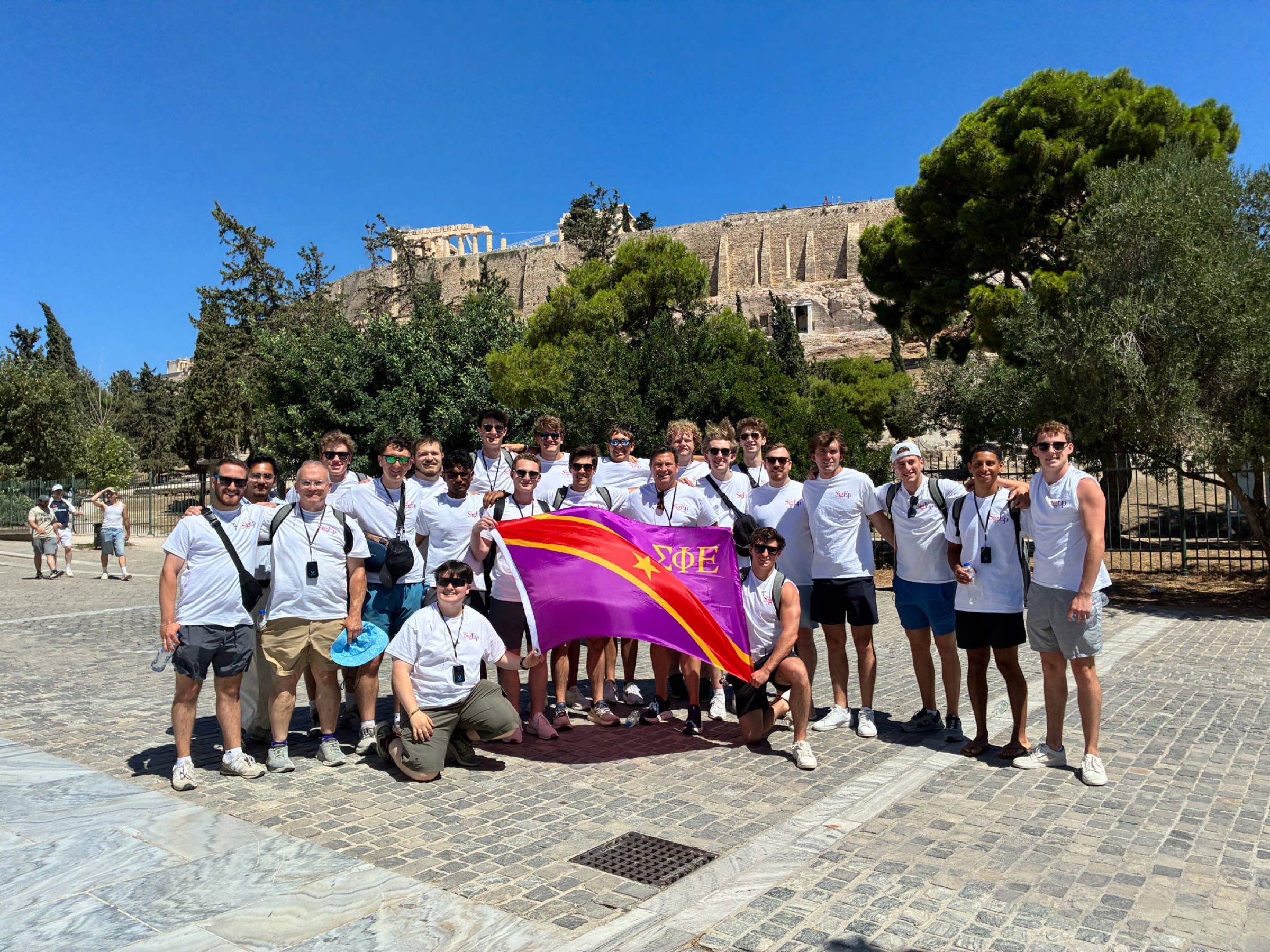 Brothers with the SigEp flag at the Acropolis in Athens.